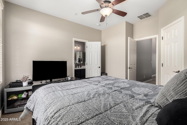 carpeted bedroom featuring ceiling fan and connected bathroom