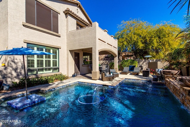 view of pool featuring a patio