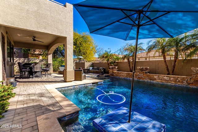 view of pool featuring a patio area, outdoor lounge area, and ceiling fan