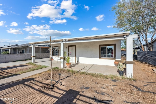 4441 S 8th St, Phoenix, AZ 85040 - view of front of home with stucco siding and a patio
