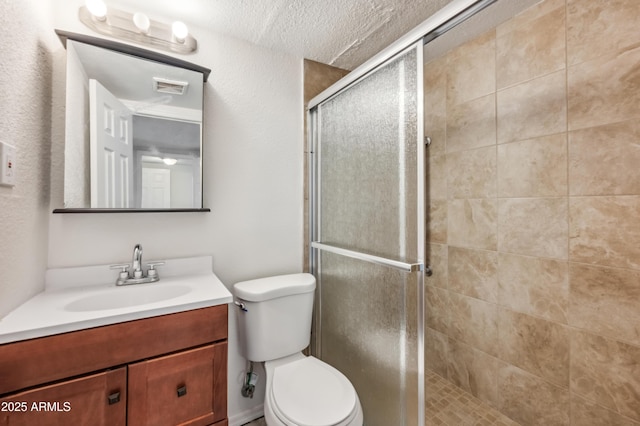 4441 S 8th St, Phoenix, AZ 85040 - bathroom featuring toilet, vanity, a shower stall, a textured ceiling, and a textured wall