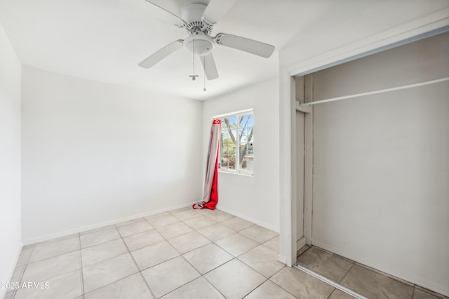 4441 S 8th St, Phoenix, AZ 85040 - unfurnished bedroom with a closet, light tile patterned flooring, ceiling fan, and baseboards