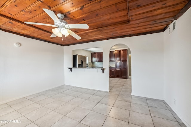 4441 S 8th St, Phoenix, AZ 85040 - unfurnished room featuring wood ceiling, light tile patterned floors, a ceiling fan, arched walkways, and a smoke detector