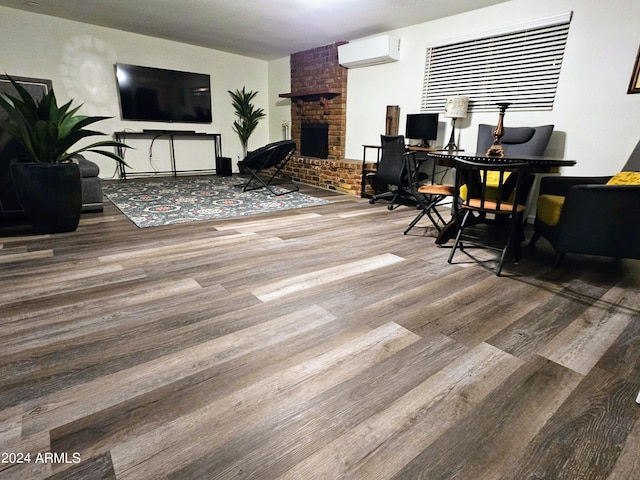 1801 N 87th Pl, Scottsdale, AZ 85257 - living area featuring wood finished floors, a brick fireplace, a wall unit AC, and an office area