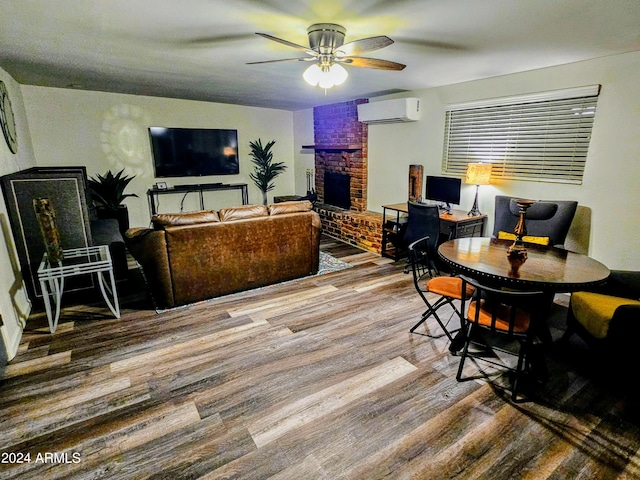 1801 N 87th Pl, Scottsdale, AZ 85257 - living area featuring a wall unit AC, a ceiling fan, wood finished floors, a fireplace, and a desk