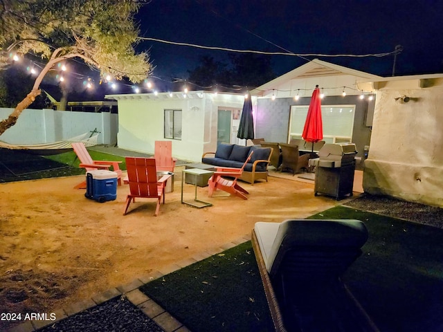 1801 N 87th Pl, Scottsdale, AZ 85257 - patio at twilight featuring an outdoor living space, grilling area, and a patio