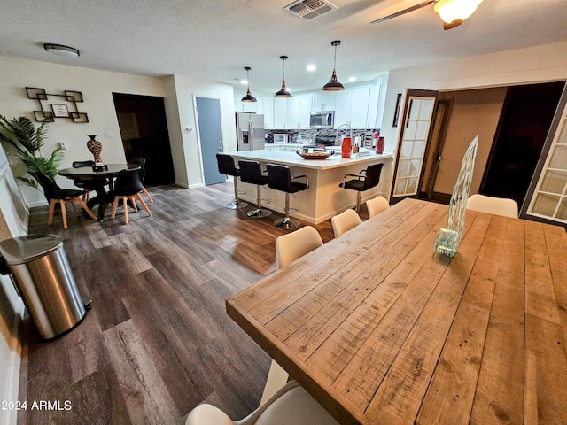 1801 N 87th Pl, Scottsdale, AZ 85257 - dining area with baseboards and dark wood finished floors
