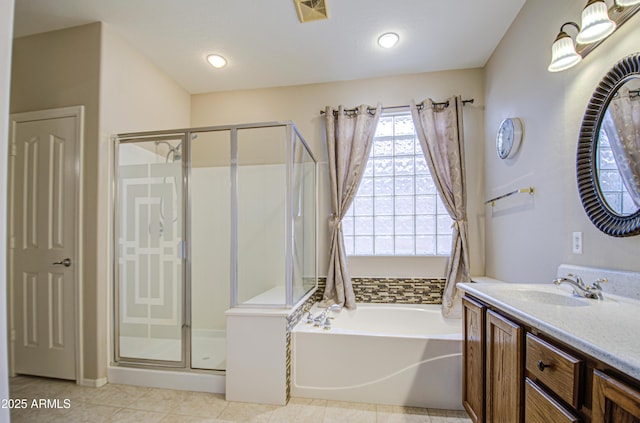 bathroom featuring tile patterned floors, visible vents, a shower stall, a bath, and vanity