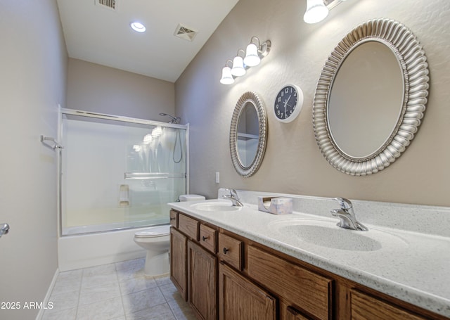 full bath featuring a sink, visible vents, toilet, and tile patterned floors