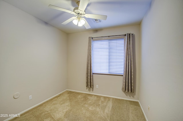 unfurnished room featuring visible vents, baseboards, ceiling fan, and carpet flooring