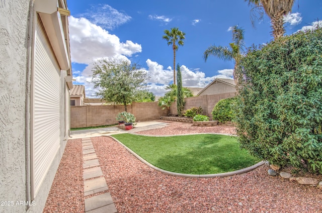 view of yard with a fenced backyard