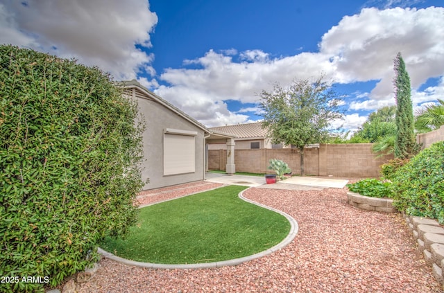 view of yard featuring a patio and a fenced backyard