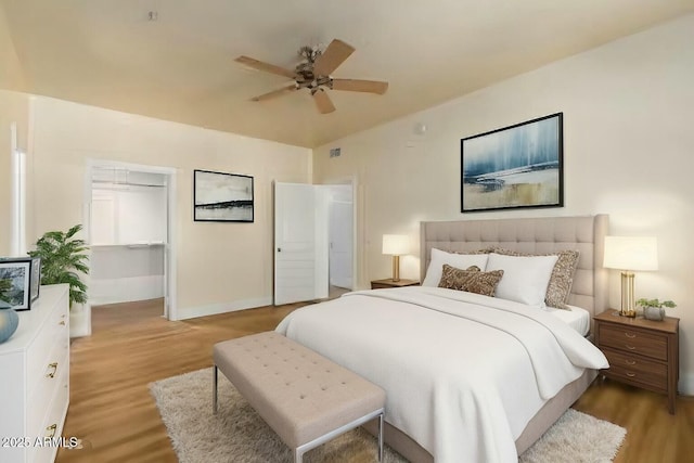 21320 N 56th St Unit 2159, Phoenix, AZ 85054 - bedroom featuring light wood-type flooring, baseboards, and a ceiling fan
