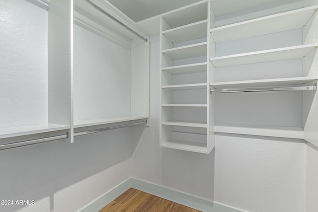 walk in closet featuring wood-type flooring