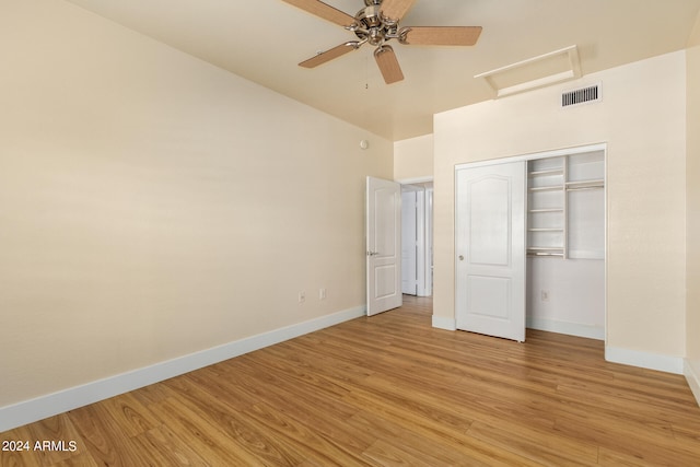 unfurnished bedroom with ceiling fan, a closet, and light hardwood / wood-style flooring