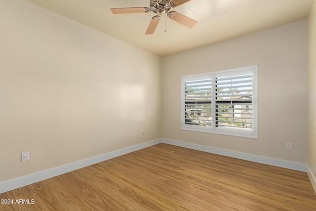 empty room featuring ceiling fan and light hardwood / wood-style flooring