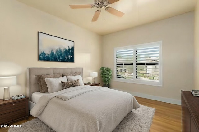 21320 N 56th St Unit 2159, Phoenix, AZ 85054 - bedroom featuring light wood finished floors, baseboards, and a ceiling fan
