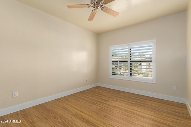 21320 N 56th St Unit 2159, Phoenix, AZ 85054 - spare room featuring baseboards, light wood-style flooring, and ceiling fan