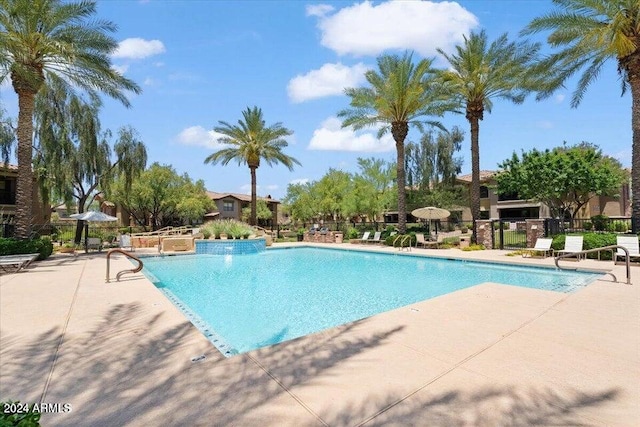 view of swimming pool with a patio area