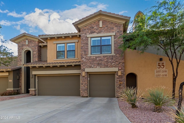 21320 N 56th St Unit 2159, Phoenix, AZ 85054 - view of front facade featuring stucco siding, a garage, and stone siding