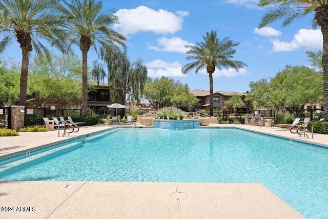 view of swimming pool featuring a patio area