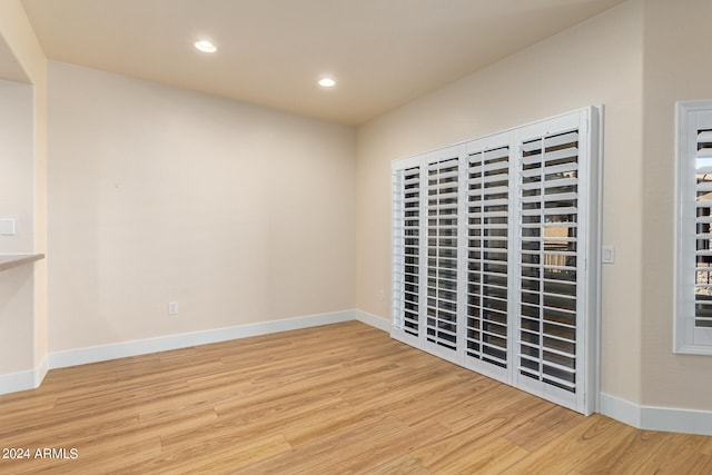 spare room with hardwood / wood-style flooring