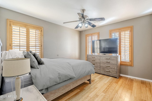 bedroom featuring ceiling fan and light wood-type flooring