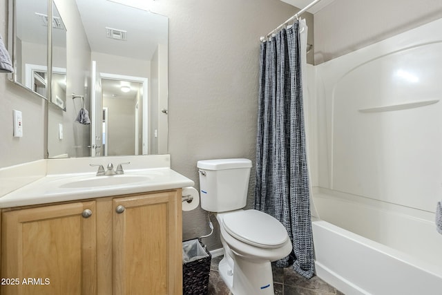 full bathroom featuring shower / bathtub combination with curtain, vanity, tile patterned flooring, and toilet