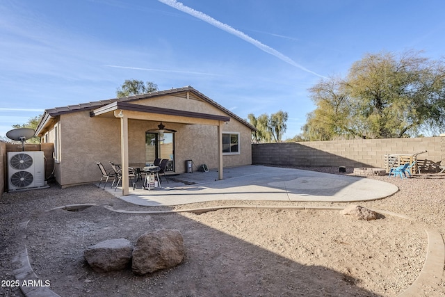 back of property with a patio and ceiling fan