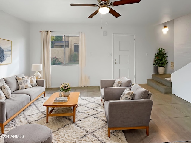 living room with ceiling fan and light tile patterned flooring