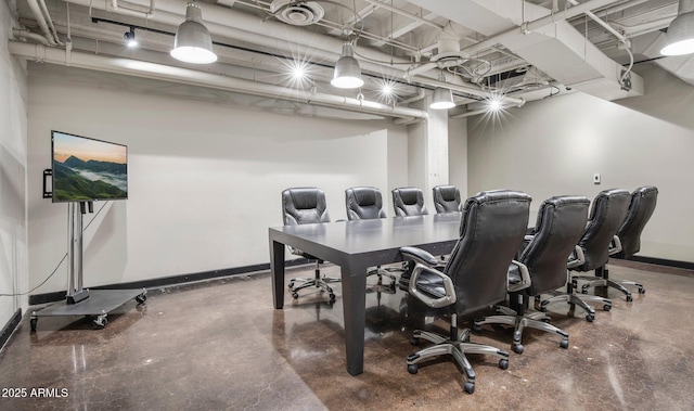 home office with concrete flooring