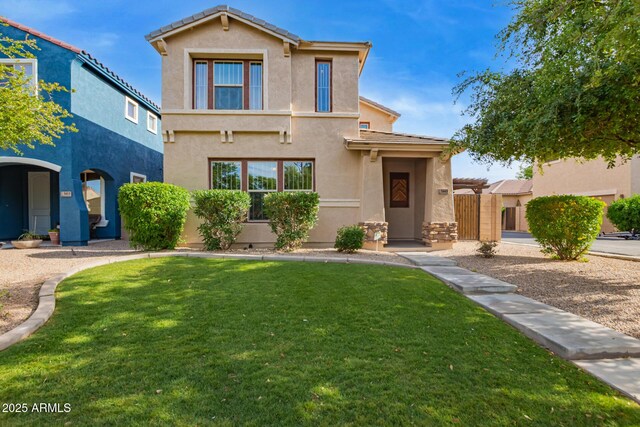 3443 E Jasper Dr, Gilbert, AZ 85296 - traditional-style house with stucco siding, a front lawn, and a tile roof