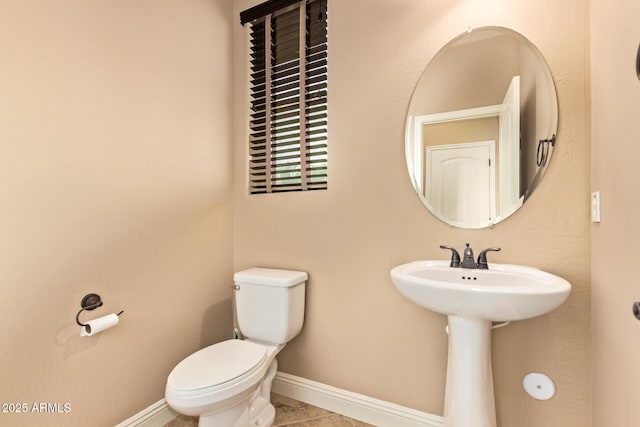 3443 E Jasper Dr, Gilbert, AZ 85296 - half bath featuring toilet, baseboards, a sink, and tile patterned floors