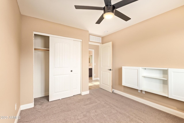 3443 E Jasper Dr, Gilbert, AZ 85296 - unfurnished bedroom featuring light carpet, a closet, baseboards, and a ceiling fan