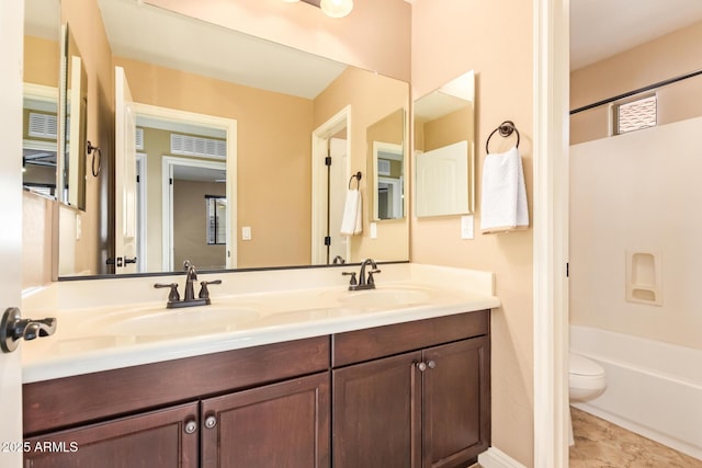3443 E Jasper Dr, Gilbert, AZ 85296 - full bathroom featuring double vanity, toilet, and shower / washtub combination