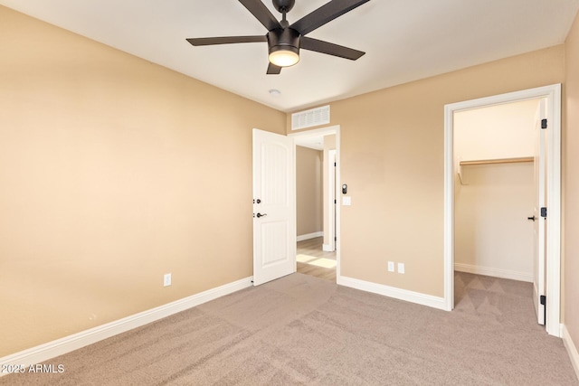 3443 E Jasper Dr, Gilbert, AZ 85296 - unfurnished bedroom featuring carpet floors, baseboards, a walk in closet, a ceiling fan, and a closet