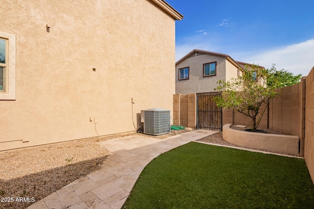 3443 E Jasper Dr, Gilbert, AZ 85296 - view of yard featuring central air condition unit and a gate