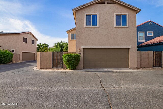 3443 E Jasper Dr, Gilbert, AZ 85296 - view of front of property featuring stucco siding, fence, and a garage