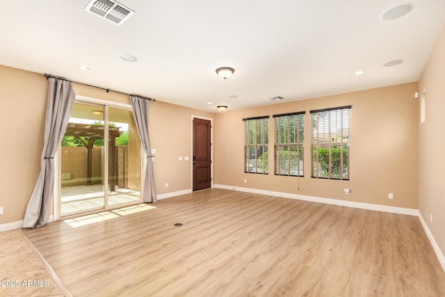 3443 E Jasper Dr, Gilbert, AZ 85296 - empty room with healthy amount of natural light, light wood-type flooring, baseboards, and recessed lighting