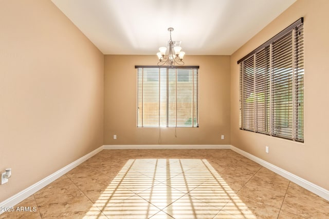 3443 E Jasper Dr, Gilbert, AZ 85296 - unfurnished room with light tile patterned floors, a chandelier, healthy amount of natural light, and baseboards