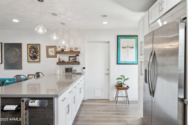 2129 W Indianola Ave, Phoenix, AZ 85015 - kitchen with stainless steel fridge with ice dispenser, open shelves, a peninsula, light wood-style floors, and white cabinets