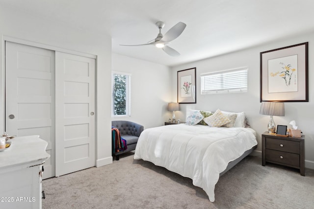 2129 W Indianola Ave, Phoenix, AZ 85015 - bedroom featuring multiple windows, light colored carpet, a closet, and ceiling fan