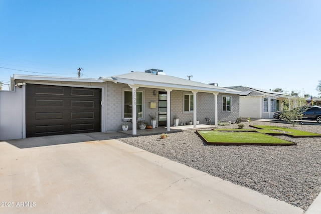 2129 W Indianola Ave, Phoenix, AZ 85015 - ranch-style home featuring driveway, a garage, and covered porch