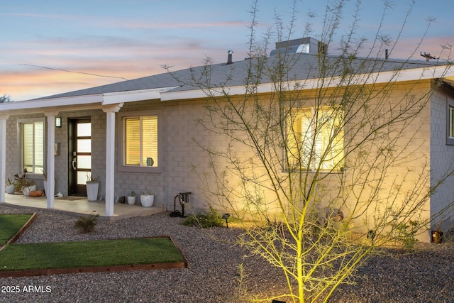 2129 W Indianola Ave, Phoenix, AZ 85015 - property exterior at dusk featuring a chimney