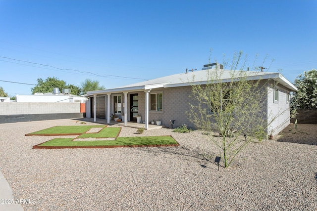 2129 W Indianola Ave, Phoenix, AZ 85015 - rear view of house with fence, an attached garage, and driveway