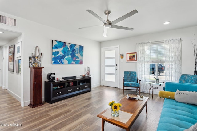 2129 W Indianola Ave, Phoenix, AZ 85015 - living room featuring plenty of natural light, light wood-type flooring, ceiling fan, and recessed lighting