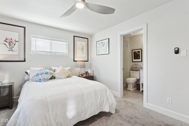 2129 W Indianola Ave, Phoenix, AZ 85015 - bedroom with baseboards, ensuite bath, light carpet, and ceiling fan