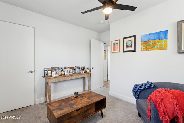 2129 W Indianola Ave, Phoenix, AZ 85015 - living area with carpet floors, a ceiling fan, and baseboards