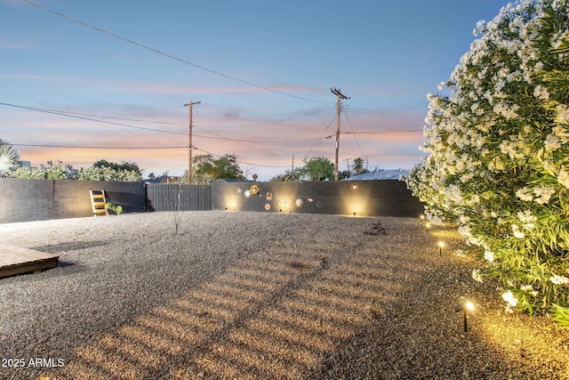 2129 W Indianola Ave, Phoenix, AZ 85015 - yard at dusk with a fenced backyard