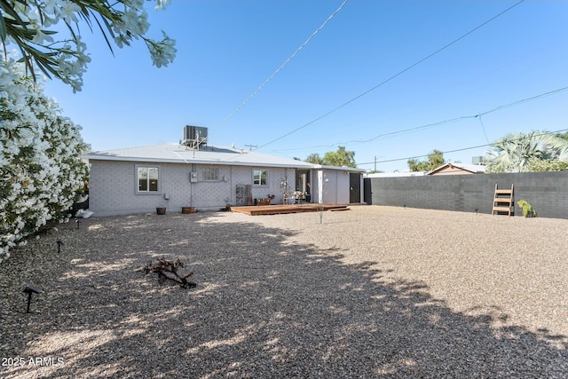 2129 W Indianola Ave, Phoenix, AZ 85015 - rear view of property featuring fence, central AC unit, and a wooden deck